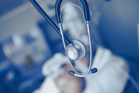 Stethoscope on the background of a hospital ward with a patient