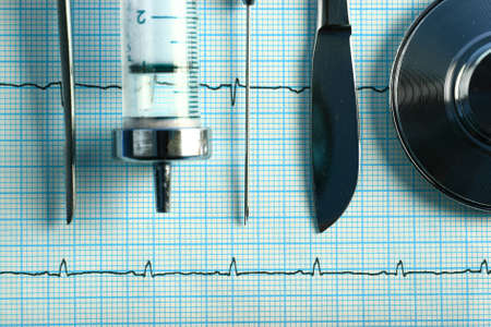 Medical instruments on a cardiogramの写真素材