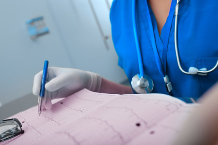 Female medical doctor working with patient examination results in her office.の写真素材