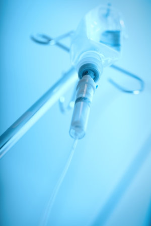 Saline drip in action in a patient emergency in an ICU.