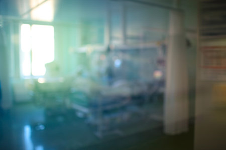 Unfocused view on the intensive care unit through the window glass.