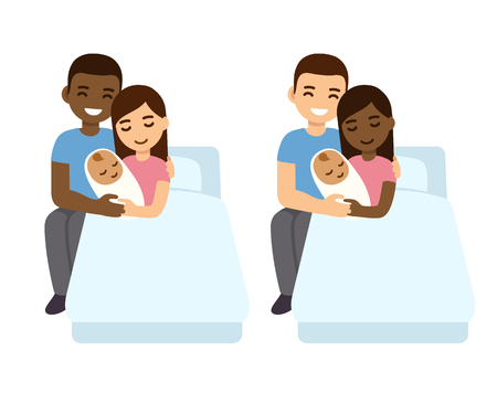 Interracial couple with newborn biracial baby in hospital bed.