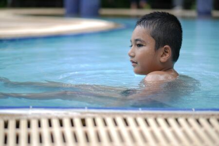 A boy in the swimming poolのeditorial素材