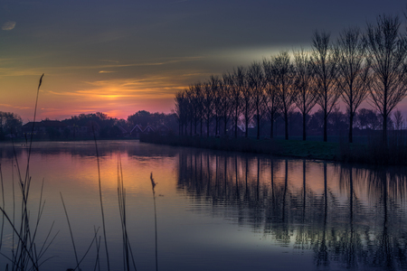 Very early morning by a canal in Hollandの写真素材