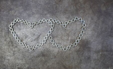Two nut heart on the metal background. The nut heart  for valentines day.の写真素材