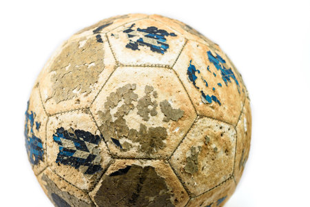 Old soccer ball isolated on white backgroundの写真素材