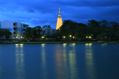 Nong Bua pagoda in Ubol Thailand. view from across the lake in Nong Bua (lotus lake) public park.の写真素材