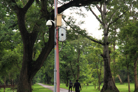 CCTV in a park overlooking people and historical site