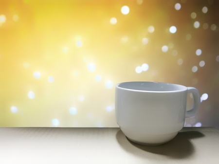 Coffee cup with bokeh soft defocused background. energy motivation conceptの写真素材