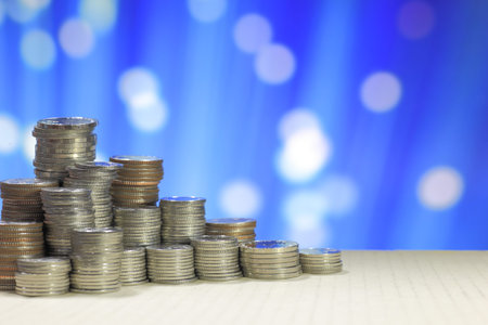 coin stack blue background. business growth, saving and investment concepts. Success business steps