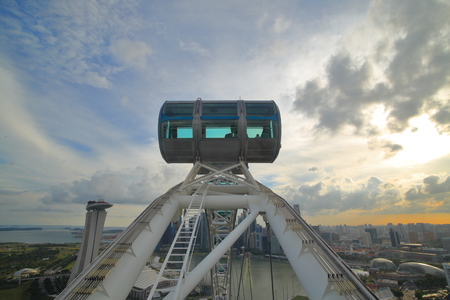 SINGAPORE-26 Aug 2017. Singapore flyer cabin high up in the sky. Singapore flyer one of the biggest ferris wheel in the world a tourist attraction overlooking Marina Bayのeditorial素材