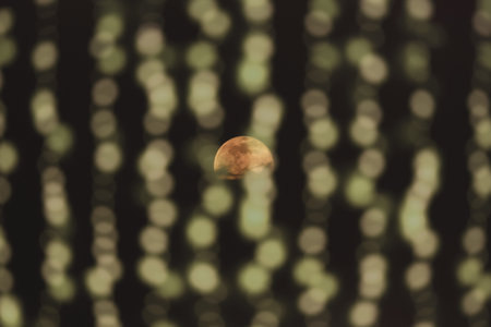 Romantic half moon with bokeh curtain in the foreground.