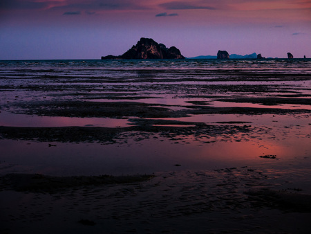 romantic atmosphere of sea side beach. purple sky after sunset.の写真素材
