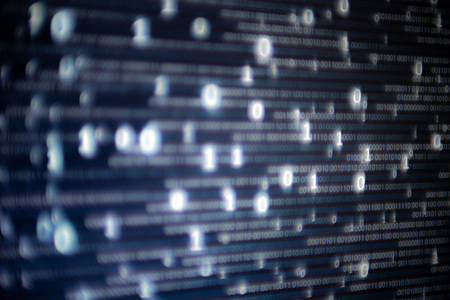 Abstract big data image. Computer display screen with binary code moving in the background. text moving in matrix code style from top moving downward to the bottom of the screen.の写真素材