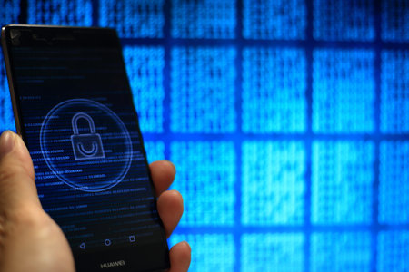 secured private data in big data era. computer code and padlock icon in a hand. mobile phone and...