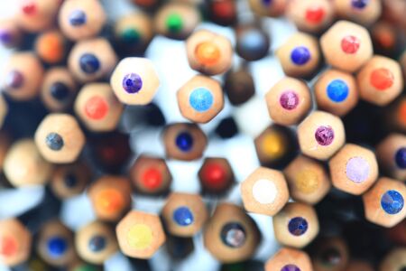 colored pencils rainbow. stacked color pencils close up shot with back light. random pattern colors placement.の写真素材