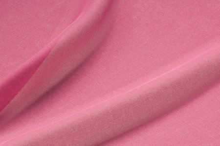 Silk crepe lies in loose folds showing the sheen of the fabricの写真素材