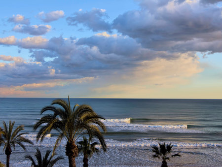 Night rolls in over the quiet evening waterの写真素材