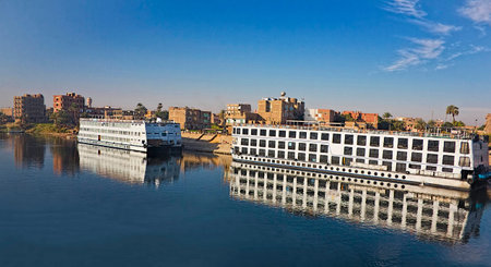 Two Nile Cruise Boats Moored Along the Roadsideの写真素材