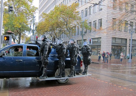 PORTLAND, OREGON - NOV 17  Police in Riot Gear Entering Downtown Portland, Oregon during a Occupy Portland protest on the first anniversary of Occupy Wall Street November 17, 2011のeditorial素材