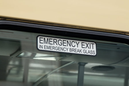 Bus window Emergency Exit sign advising breaking glass.の写真素材
