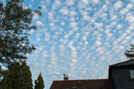 Altocumulus clouds early evening in August, England.の写真素材