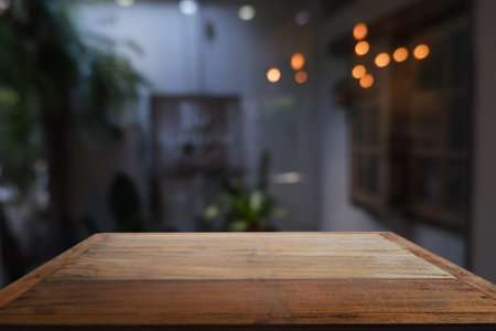 Wood table in front of blurred cafe interior