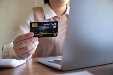 Women purchasing online using credit card payments via laptop, Shopping online and banking online conceptの写真素材