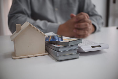 Copped images of real estate agent and customer agree to sign contract for buy a new property, homeの写真素材