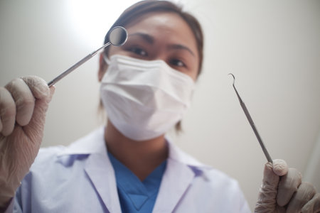 Female Dentist working in officeの写真素材
