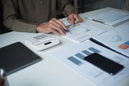 Businessman reading report in office desk analyse data for plan projectの写真素材