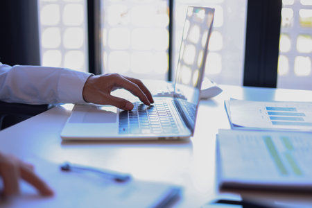 Businessman working in office using laptop.の写真素材