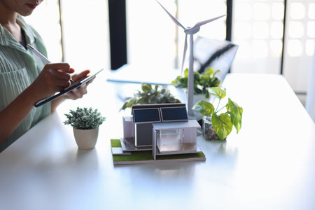 Beautiful engineer working in office design eco friendly and sustainable living home.の写真素材