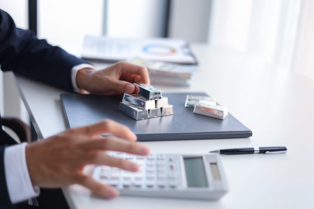 Silver Trading Businessman invest in trading silver, calculating profit price of  buying and selling...