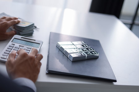 Silver Trading Businessman invest in trading silver, calculating profit price of  buying and selling silver in the market.の写真素材