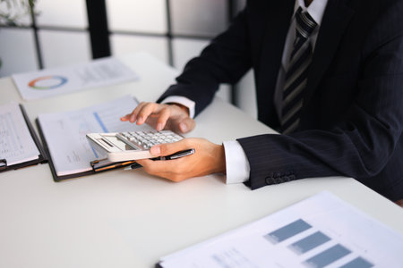 Businessman working in office calculating tax.の写真素材