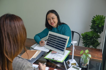 A sales representative presenting solar and wind power, alternative energy, clean energy for future