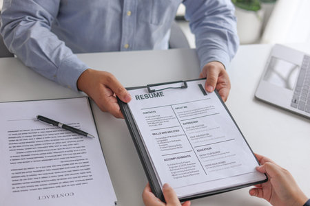 Business People Reviewing Resume During Job Interview Meeting.