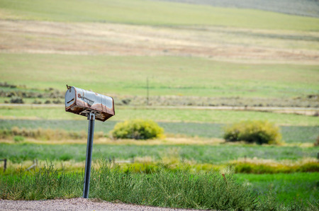 Rusty, old, crooked mailbox in rural americaの写真素材