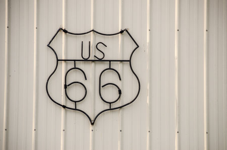 Wrought iron sign with a crooked S for US Route 66