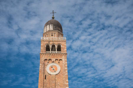 Chiesa Saint Andrea catholic church building with brick bell tower, Chioggia, Italy.の写真素材