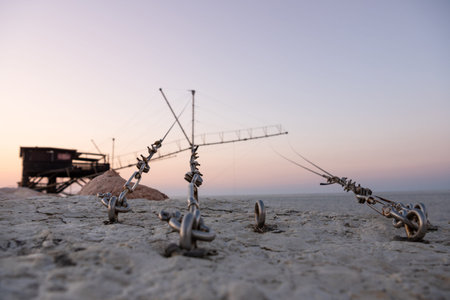 Traditional fishing house at sunrise, Dam of Sottomarina, Chioggia, Italy.の写真素材