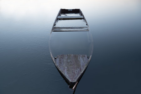 Boat under water at the lake. Sunken boat