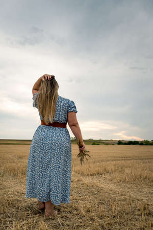Happy and satisfied beautiful plus size model outdoor.の写真素材