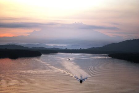 sulaman river with kinabalu mountain backgroundの写真素材