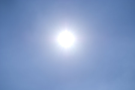 A shining sun/ star on a clear blue sky with no clouds