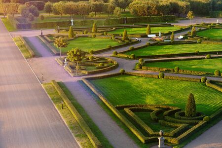classic park with avenues, sculptures and a green maze. Creation of human handsの写真素材