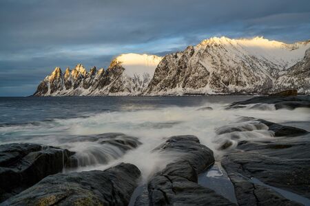 Beautiful winter landscape scene in Steinfjord and mountain in background in Northern Norway. unset or sunrise in Mountains And Fjords.の写真素材