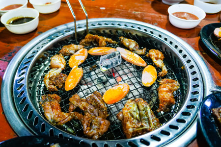 typical Vietnamese roasted frog legs and seafood with vegetablesの写真素材