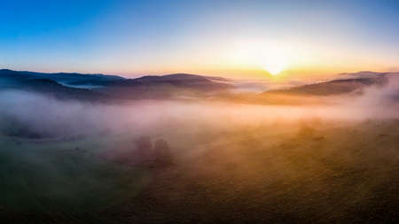 beautiful landscape with valleys, lakes and rivers in fog under High Tatrasの写真素材